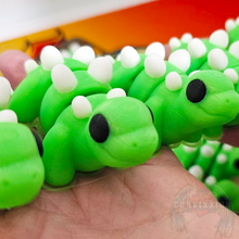 Load image into Gallery viewer, Convixxion Glow-in-the-Dark Articulated Stegosaurus Desk Fidget Figure - Tiny Stego Desk Accessory