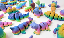 Load image into Gallery viewer, Assorted 3D printed stress relief animals in glossy, matte, and silk rainbow finishes, including creatures like lizards, unicorns, sharks, shown together.