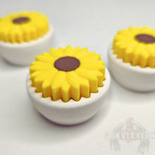 Load image into Gallery viewer, Sunflower clicker fidget with a yellow flower top and a white base, designed for stress relief and sensory engagement.