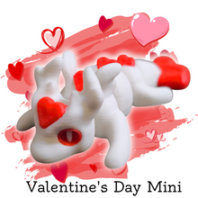 Load image into Gallery viewer, Mini articulated Valentine Love Dragon figure with smooth joints, featuring a white body and red heart accents on its head, back, and tail, displayed on a textured stone surface. Perfect for stress relief, fidgeting, or as a decorative item.