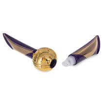 Load image into Gallery viewer, Harry Potter Golden Snitch lip balm duo by Mad Beauty, shown with one purple and gold striped squeeze tube attached to the gold Snitch-shaped center and the second tube detached on a white background.