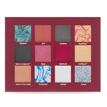 Load image into Gallery viewer, Open Harry Potter Mad Beauty eyeshadow palette showing twelve square pans arranged in a 3x4 grid on a burgundy background, with shades labeled Slytherin, Quill, Cauldron, Gryffindor, Back to Hogwarts, Magic, Spellbook, Hufflepuff, Wand at the ready, Ravenclaw, Hedwig, and Lumos in a mix of marbled, shimmer, and matte finishes.
