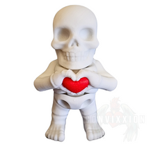 Load image into Gallery viewer, High-quality mini skeleton figure holding a red heart, featuring smooth articulation and a detailed design. Ideal as a desk companion, fidget, or collector’s display piece. By Convixxion.