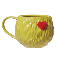 Load image into Gallery viewer, The Grinch Change of Heart 16 oz ceramic mug by Enesco featuring a bright green textured surface and a raised red heart.