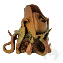 Load image into Gallery viewer, Left side view of the Convixxion Pirate Captain Skull Dice Tower with tentacles emerging from its mouth. A legendary skull-themed dice tower perfect for tabletop gaming.