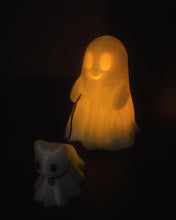 Load image into Gallery viewer, 3D printed Ghost and Cat Bestie decor, featuring a whimsical ghost and cat design in white, displayed in with a flameless tea light inside.