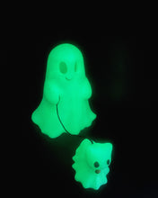 Load image into Gallery viewer, 3D printed Ghost and Cat Bestie decor, featuring a whimsical ghost and cat design in white, displayed in at night to show glow in the dark properties.
