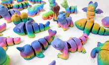 Load image into Gallery viewer, Assorted 3D printed stress relief animals in glossy, matte, and silk rainbow finishes, including creatures like lizards, unicorns, sharks, shown together.
