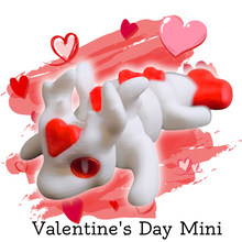 Load image into Gallery viewer, Mini articulated Valentine Love Dragon figure with smooth joints, featuring a white body and red heart accents on its head, back, and tail, displayed on a textured stone surface. Perfect for stress relief, fidgeting, or as a decorative item.
