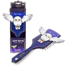 Load image into Gallery viewer, Harry Potter Hedwig “Owl Post” hair brush by Mad Beauty, shown in purple character-themed packaging and lying flat beside the box, featuring Hedwig with outstretched wings holding a Hogwarts letter, on a white background.
