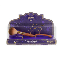 Load image into Gallery viewer, Harry Potter Nimbus-inspired broomstick makeup brush by Mad Beauty displayed in a purple stadium-style box with gold hoops design, perfect for cosmetic fans and collectors.
