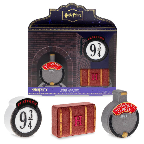 Harry Potter Platform 9¾ bath fizzer trio by Mad Beauty, with brick-themed gift box packaging and three bath fizzers shaped like the Platform 9¾ sign, a Hogwarts trunk with an “H,” and the Hogwarts Express front, shown on a white background.