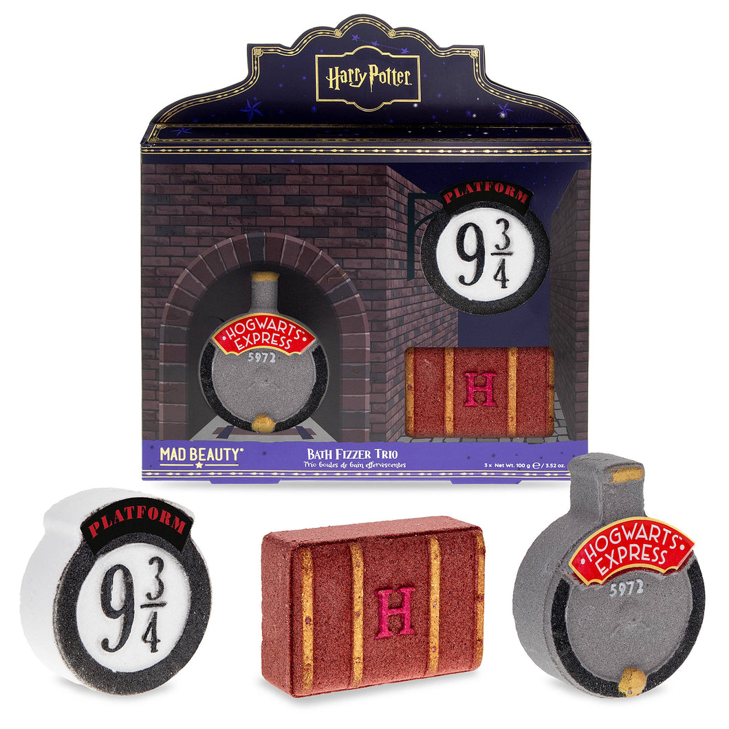 Harry Potter Platform 9¾ bath fizzer trio by Mad Beauty, with brick-themed gift box packaging and three bath fizzers shaped like the Platform 9¾ sign, a Hogwarts trunk with an “H,” and the Hogwarts Express front, shown on a white background.